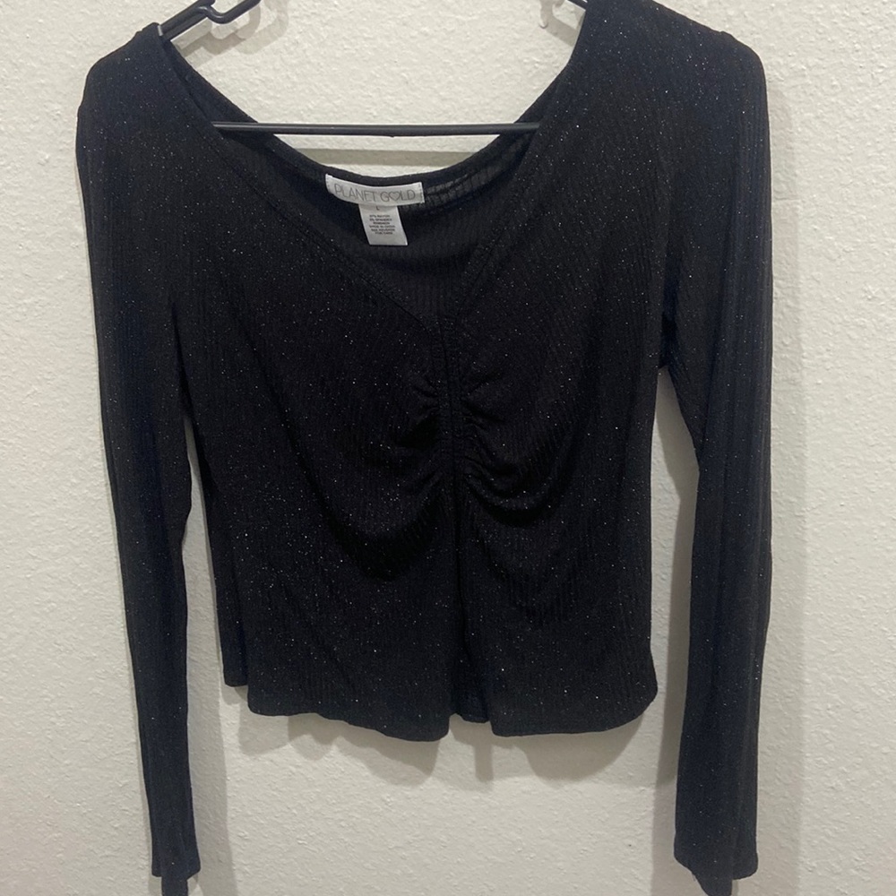 Loose fitting, formal sparkly shirt.